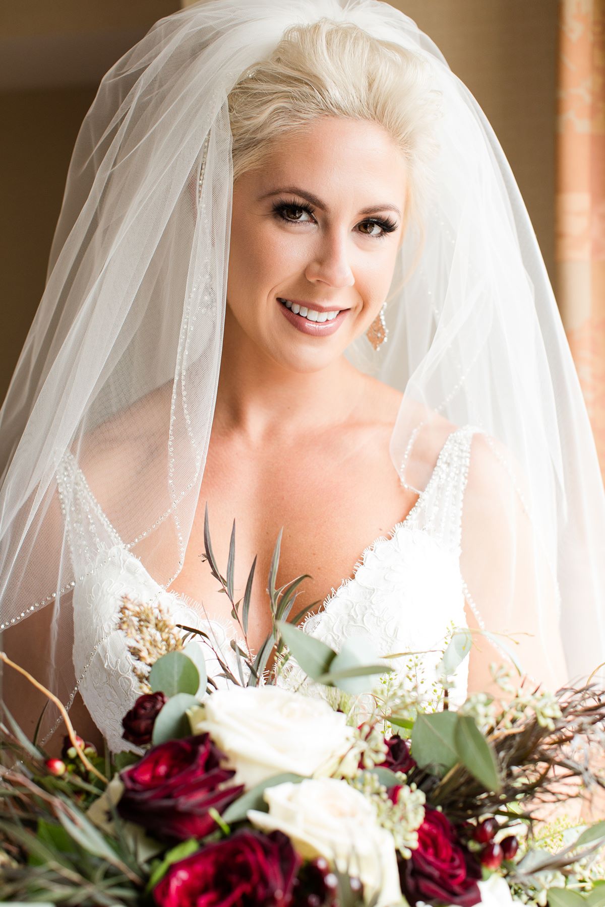 Bride in off-shoulder lace wedding dress with bridal hair and makeup by Doorbell Salon CT