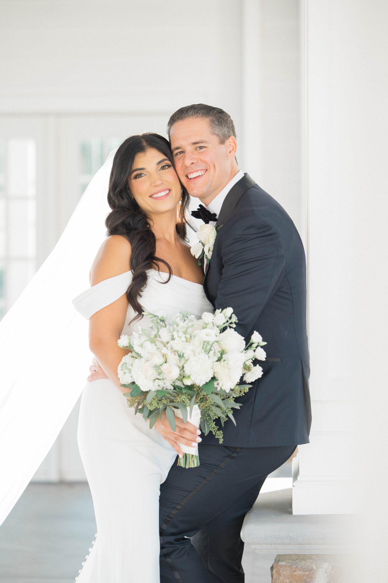 Bride and groom portrait at white estate venue with bridal hair and makeup by Doorbell Salon CT