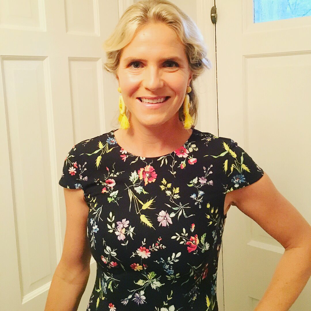 Bride and bridesmaids in chocolate dresses on grand staircase with professional styling